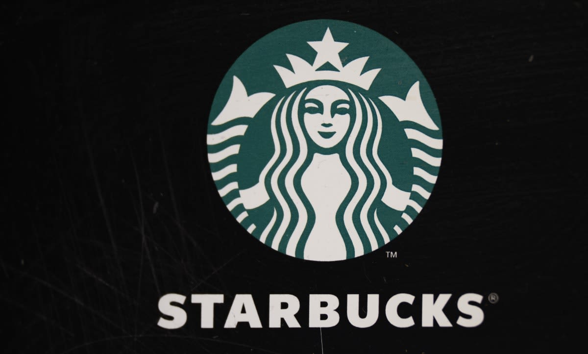 Image Source:  Starbucks Cafe logo at Rua dos Clerigos on March 23, 2024, in Porto, Portugal. (Photo by Horacio Villalobos#Corbis/Corbis via Getty Images)